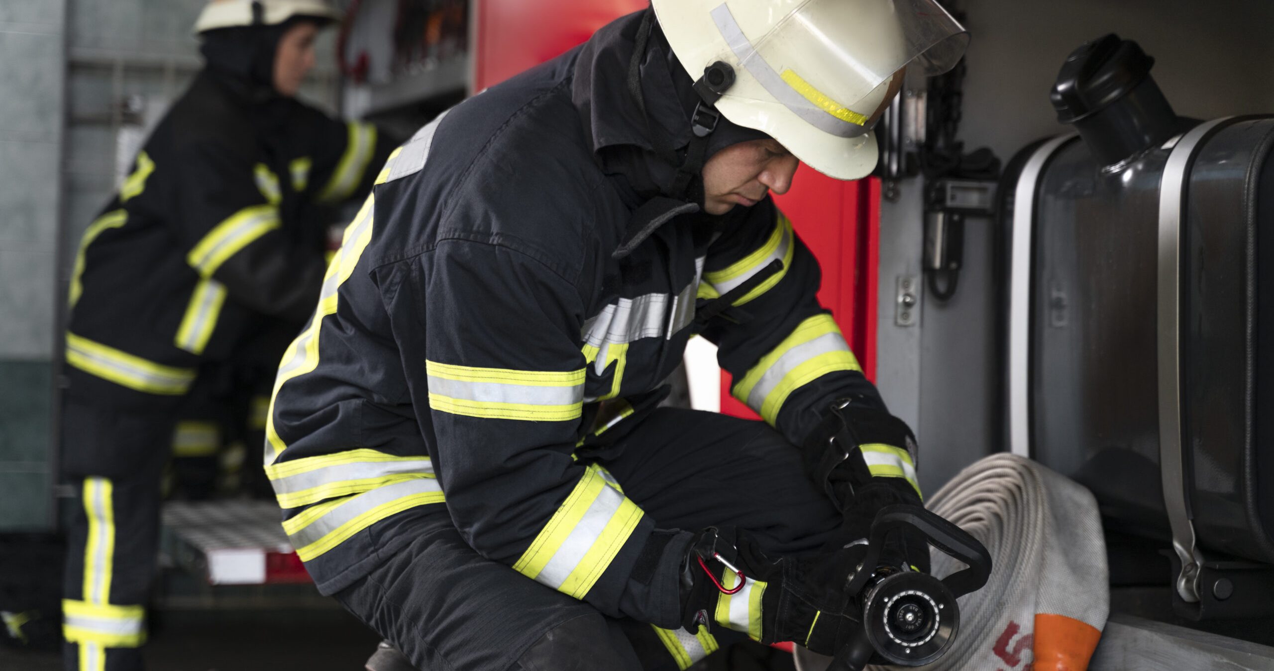male female firefighters working together suits helmets
