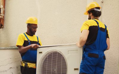 servicemen teamworking on hvac system